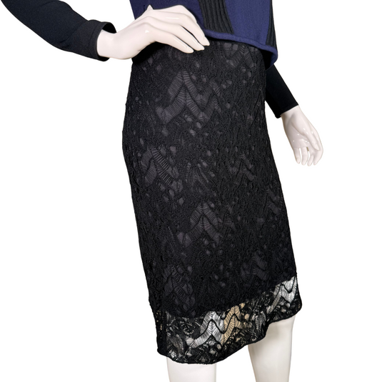 Elegant and timeless, this donated Eileen Fisher Black Skirt with Knit Lace Overlay features an all-over floral lace overlay with intricate patterns that add texture and dimension.