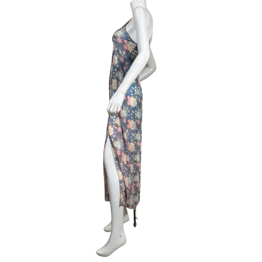breezy Free People Blue Floral Maxi Dress features a dark blue base adorned with a vintage-inspired floral pattern in shades of cream, pink, and light green