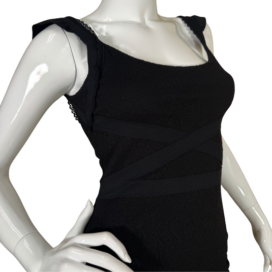 Free People Elegant Black Bodycon Dress is a wardrobe essential, designed to hug your curves in all the right places