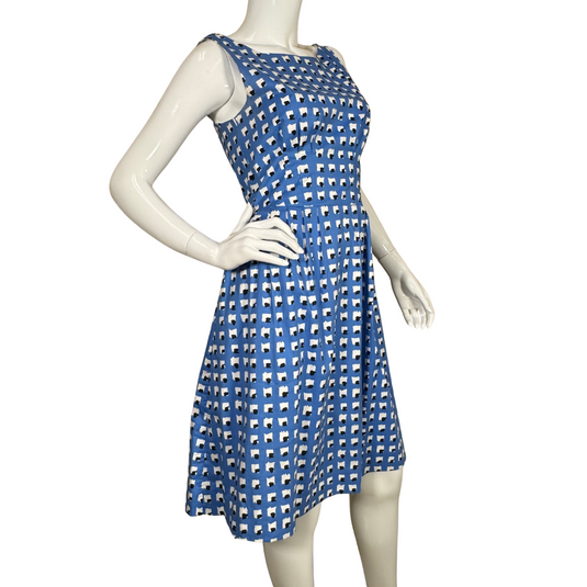 charming sleeveless Kate Spade Blue Dress With Abstract White and Black Squares features a classic fit-and-flare silhouette with a flattering cinched waist and pleated skirt