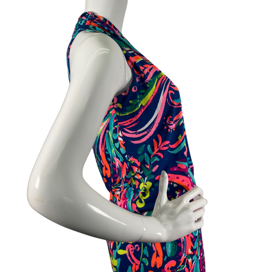 Lilly Pultizer Psychedelic Neck Drop Cinched Waist Minidress is a vibrant, sleeveless dress with a colorful abstract pattern featuring shades of pink, green, yellow, and blue on a dark navy background - side view close-up