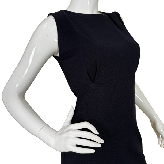 Black dress on a white mannequin against a white background