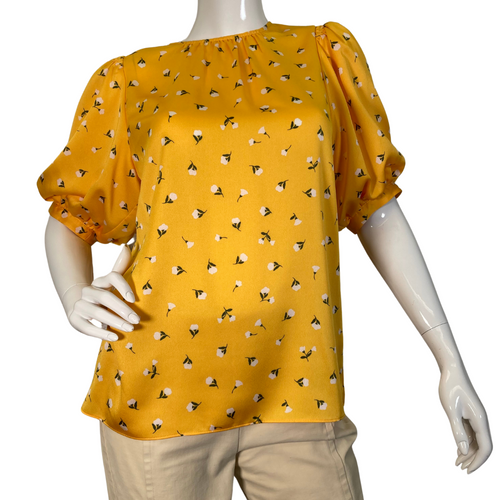  Kate Spade Vibrant Yellow Blouse Featuring Small White Flowers is a cheerful, mustard-yellow blouse featuring a delicate floral print throughout - front view