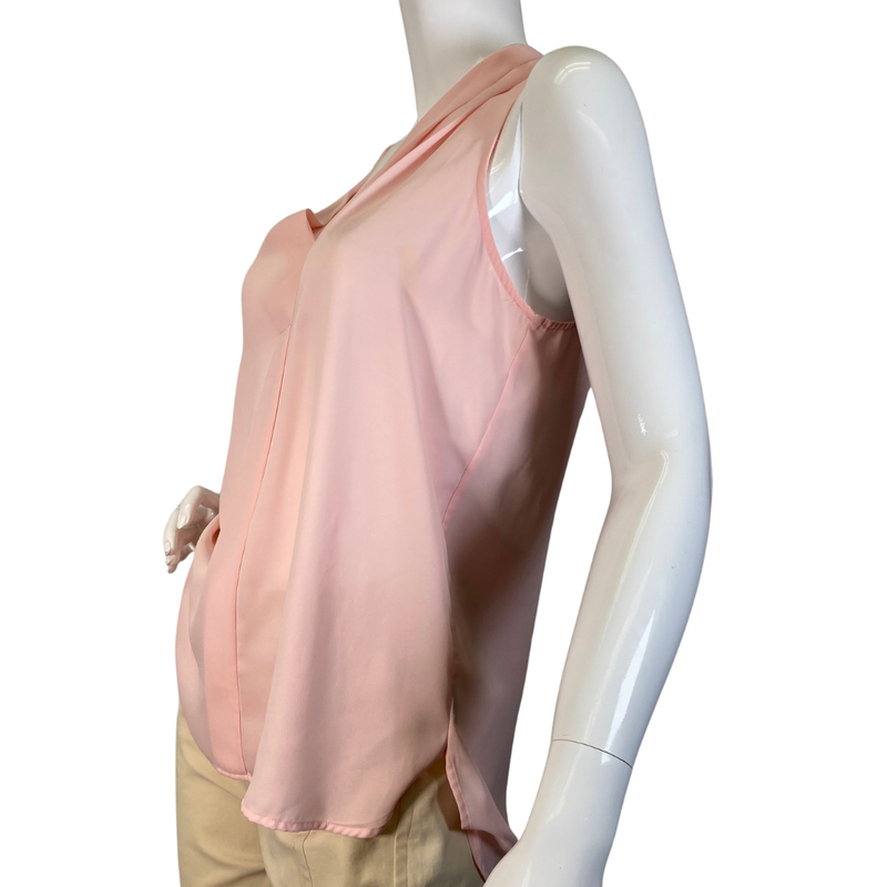 Load image into Gallery viewer, Vince Camuto Light Pink Sheer Sleeveless Blouse in a soft pastel pink color features a draped V-neckline with a relaxed, flowy fit - side view
