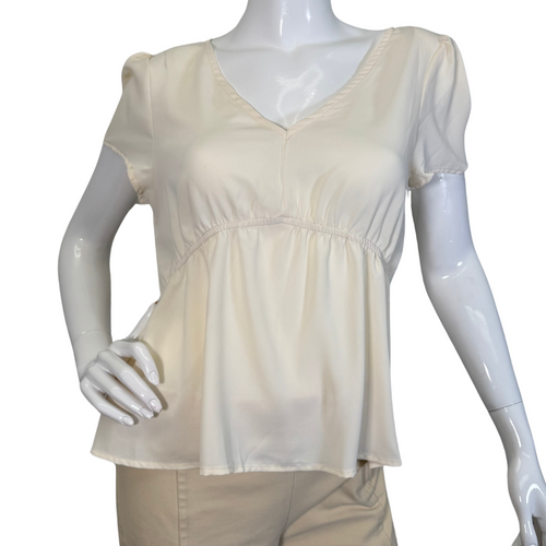 Eden In Love Elegant Cream Blouse is a minimalist design in a solid cream or off-white color - front view