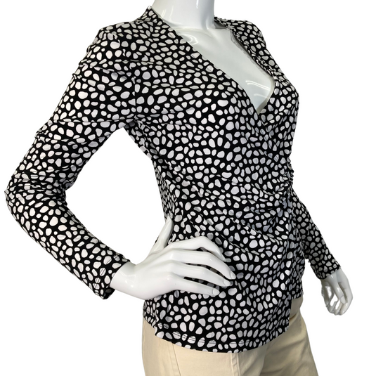 Tahari Black and White Polka Dot Blouse with black and white polka-dot print top featuring a flattering V-neckline - side view