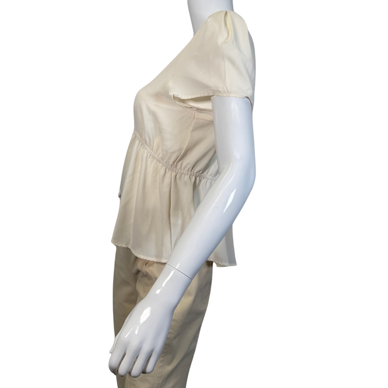 Load image into Gallery viewer, Eden In Love Elegant Cream Blouse is a minimalist design in a solid cream or off-white color - side view
