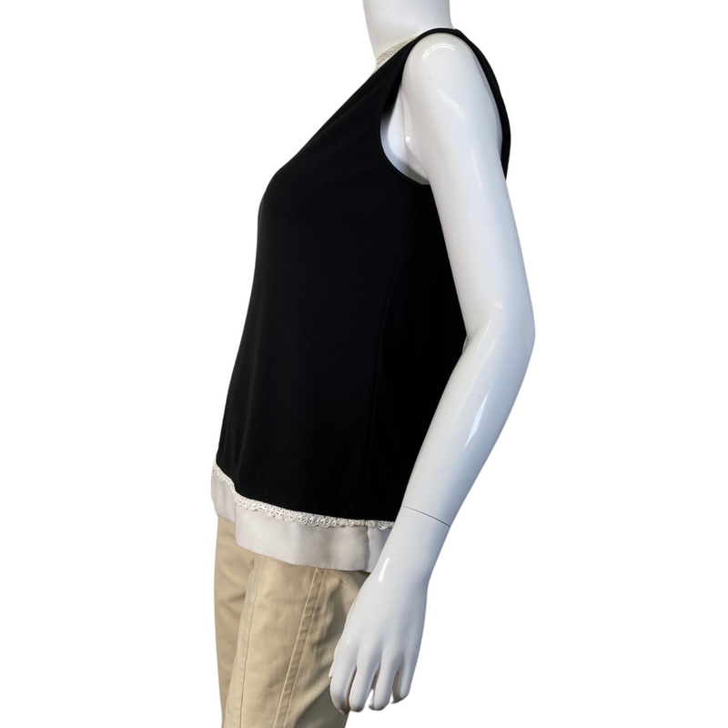 Load image into Gallery viewer, Karl Lagerfeld Black Blouse with Lace Neckline features a sleeveless black top with elegant white lace detailing - side view
