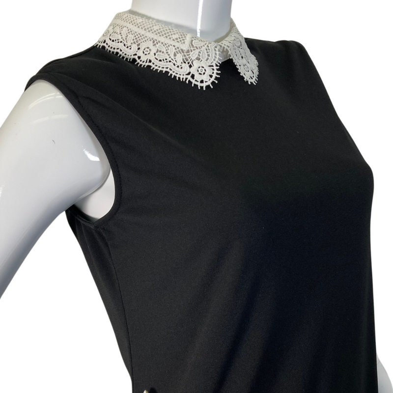 Load image into Gallery viewer, Karl Lagerfeld Black Blouse with Lace Neckline features a sleeveless black top with elegant white lace detailing - close up view of neck lace 
