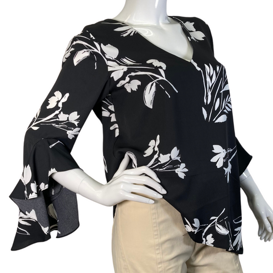 Vince Camuto Black Blouse White Florals features a stylish black blouse with a white floral print design - ide view