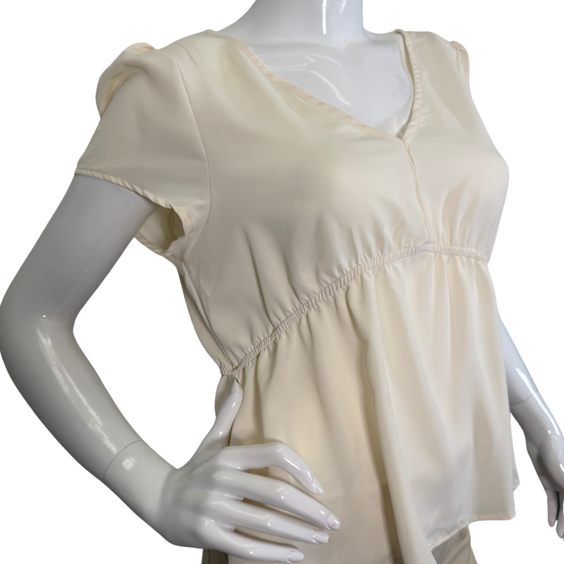 Load image into Gallery viewer, Eden In Love Elegant Cream Blouse is a minimalist design in a solid cream or off-white color - close up view
