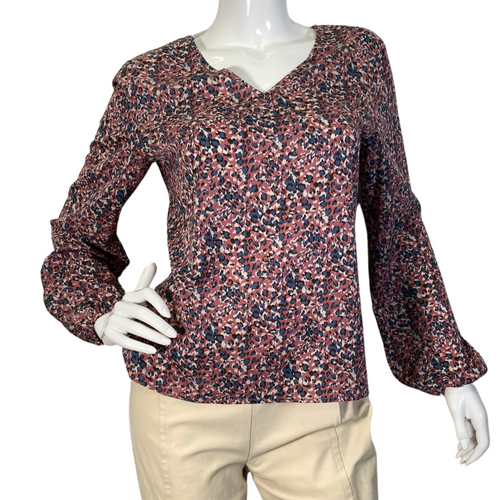 Eden In Love Dusty Pink Leopard Blouse is a long-sleeve, V-neck blouse with a multicolored abstract floral pattern in shades of red, pink, navy blue, and white - front view