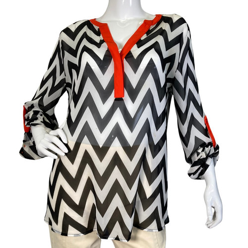 Vince Camuto Black and White Patterned Sheer blouse with Red Accents is a stylish women's tunic-style blouse with a bold black-and-white chevron print - front view