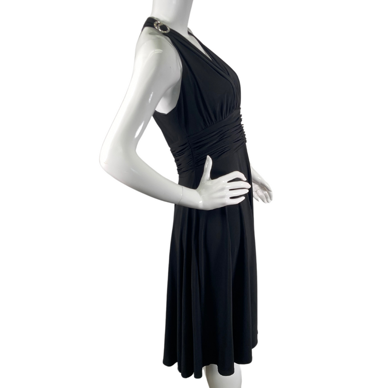 Load image into Gallery viewer, Evan Picone Black Dress with Elastic Waist is a knee-length halter dress, featuring a plunging V-neckline and ruched detailing along the bodice for a flattering fit - side view
