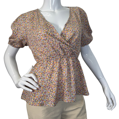 Eden In Love Delicate Colorful Floral Blouse is a floral blouse with a delicate pattern featuring small, multicolored flowers - front view