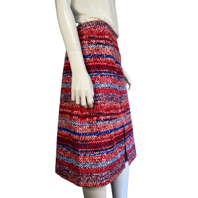 Load image into Gallery viewer, The unique print of this mid-length Tory Burch skirt sets it apart as a statement-making choice to pair with any neutral top. Brand: Tory Burch Tag size: 6. Patriotic coloring, 4th of July skirt, donated clothing, thrifting, end fast fashion. Shop small, shop local.
