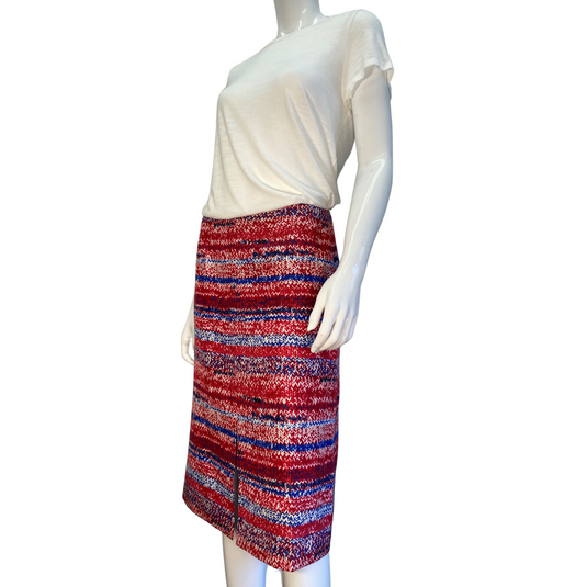 The unique print of this mid-length Tory Burch skirt sets it apart as a statement-making choice to pair with any neutral top. Brand: Tory Burch Tag size: 6. Patriotic coloring, 4th of July skirt, america print, donated clothing, thrifting, end fast fashion. Shop small, shop local.