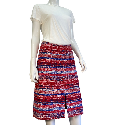 The unique print of this mid-length Tory Burch skirt sets it apart as a statement-making choice to pair with any neutral top. Brand: Tory Burch Tag size: 6. Patriotic coloring, 4th of July skirt, donated clothing, thrifting, end fast fashion. Shop small, shop local.