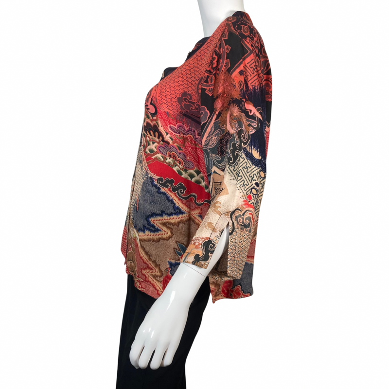 Load image into Gallery viewer, Citron Electric Blouse with Mix of Patterns and Colors showcases a patchwork of intricate designs, including floral, geometric, and traditional Asian motifs - side view
