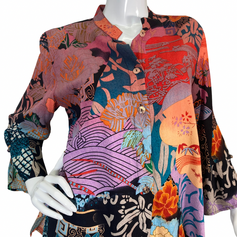 Load image into Gallery viewer, Citron Vibrant Pink and Purple Collage Blouse has a bold, artistic design with a mix of colors - close-up view
