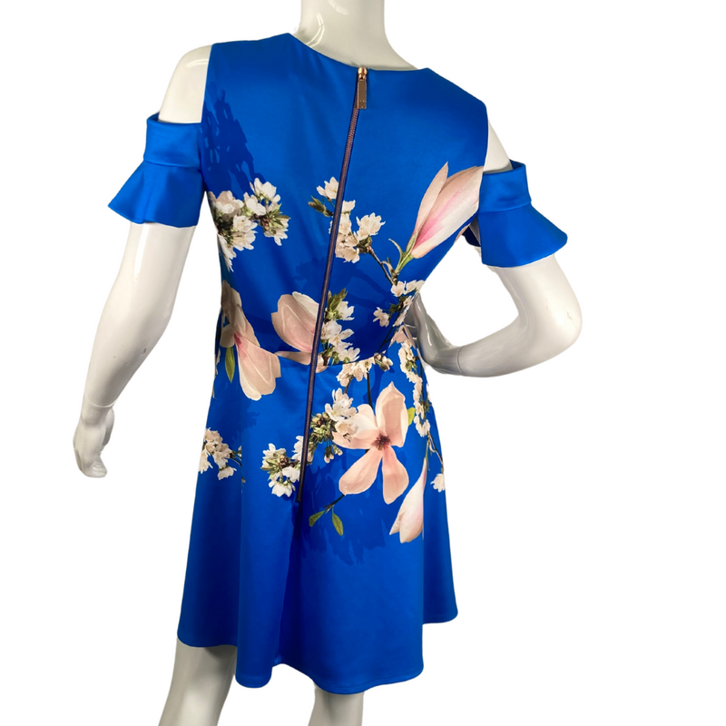 Load image into Gallery viewer, charming pre-loved Ted Baker Rich Blue Dress in White Delicate Florals, a featuring large magnolia blossoms and delicate white flowers - backside view
