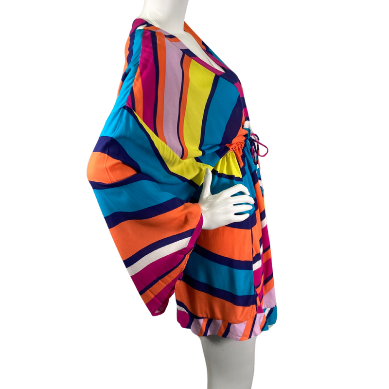 Load image into Gallery viewer, Trina Turk Bright Colorful Cover-Up is a colorful, bohemian-style mini dress featuring a bold, multi-colored stripe pattern in shades of orange, blue, pink, yellow, and purple - side view
