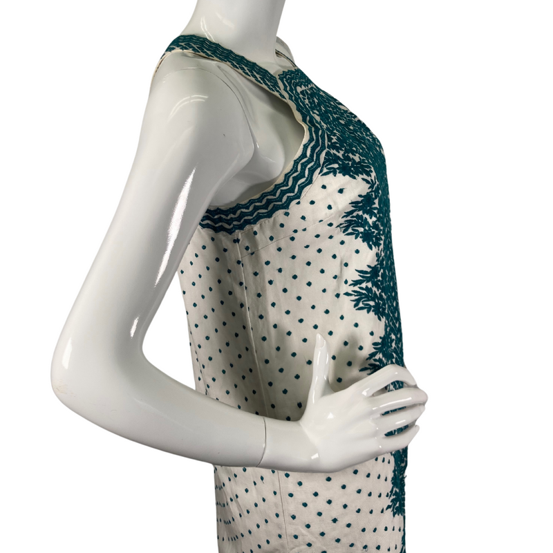 Load image into Gallery viewer, Maeve by Anthropologie White Linen Dress with Turquoise Embroidery is a sleeveless, halter-style mini dress with a vintage-inspired design - side view close-up
