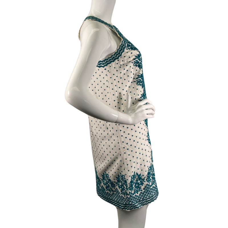 Load image into Gallery viewer, Maeve by Anthropologie White Linen Dress with Turquoise Embroidery is a sleeveless, halter-style mini dress with a vintage-inspired design - side view
