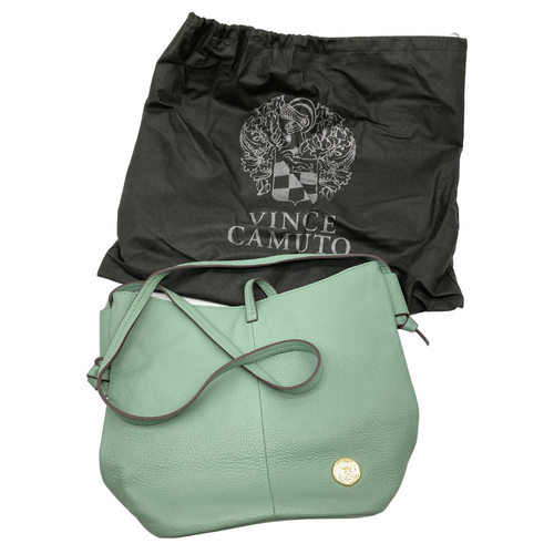 Vince Camuto Seafoam Green Shoulder Bag is a stylish, soft sage green leather handbag with a minimalist design. It features an adjustable shoulder strap, making it perfect for crossbody or shoulder wear. 