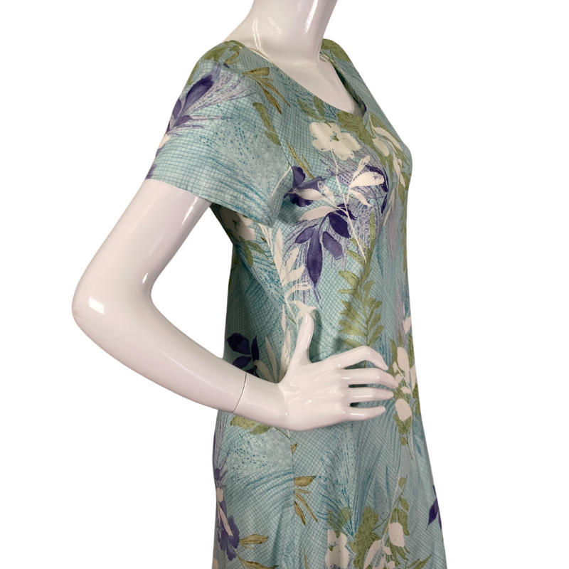 Load image into Gallery viewer, Nani Hawaii Light Blue Botanical Dress is a long, flowing style with short sleeves and a scoop neckline - close-up
