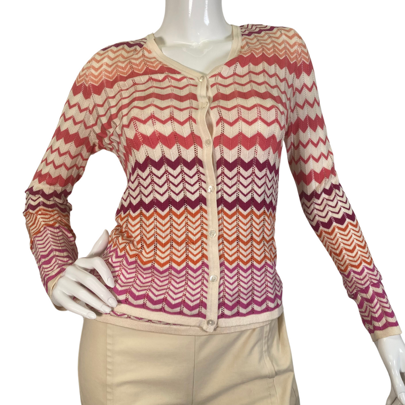 Load image into Gallery viewer, Neiman Marcus Exclusive Silk Tank Top and Sweater is a lightweight women’s cardigan featuring a vibrant zigzag pattern in shades of red, orange, and cream - front view buttoned up 
