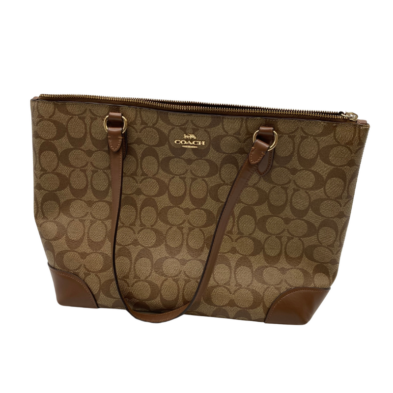 Load image into Gallery viewer, Coach Signature Tote Bag, featuring the brand’s iconic “C” monogram pattern in a beige and brown colorway - front view
