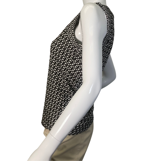 Maeve by Antrhropologie Black and White Eye-catching Knit Tank top is a sleeveless women’s top with a high neckline, featuring a black-and-white open-knit pattern - side view