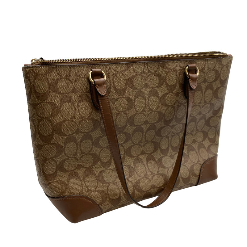 Load image into Gallery viewer, Coach Signature Tote Bag, featuring the brand’s iconic “C” monogram pattern in a beige and brown colorway - backside view
