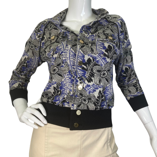 uicy Couture Abstract floral Jacket in black, blue and White with Gold Threading is a stylish, fitted jacket with a vibrant floral and botanical print in shades of blue, green, and purple - front view