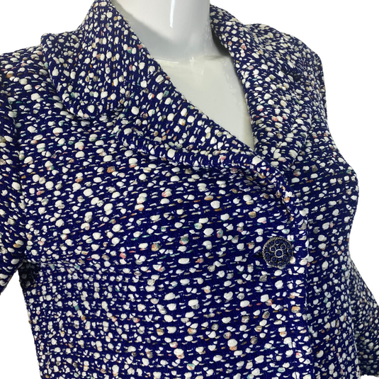 St. John Warm Playful Blue and White Coat Jacket is a women’s button-up blouse with a multi-colored polka-dot like pattern on a dark background - close up view