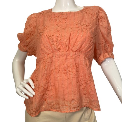 Amandi Orange Embroidered Blouse with Flowers is a women’s short-sleeve blouse in a warm orange color, featuring an embroidered floral design - front view