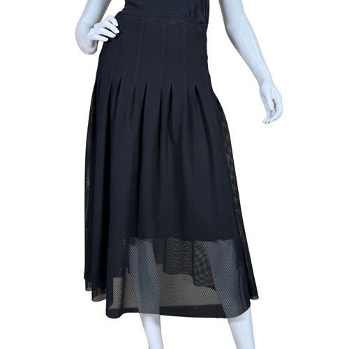 elegant Akris Black Pleated Midi Skirt with Overlay features fine pleating that begins just below the hips, creating graceful movement and a timeless silhouette.