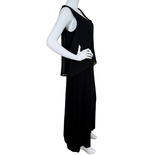 Black sleeveless dress on a mannequin against a white background