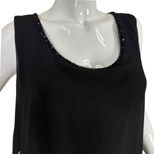 Black sleeveless top with beaded neckline on a mannequin against a white background