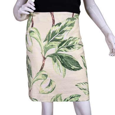 knee-length pre-loved Ann Taylor Leaf Print Mini Skirt showcases a bold botanical print of green leaves and soft brown stems against a creamy beige background.