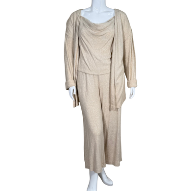 Beige outfit on a mannequin against a white background