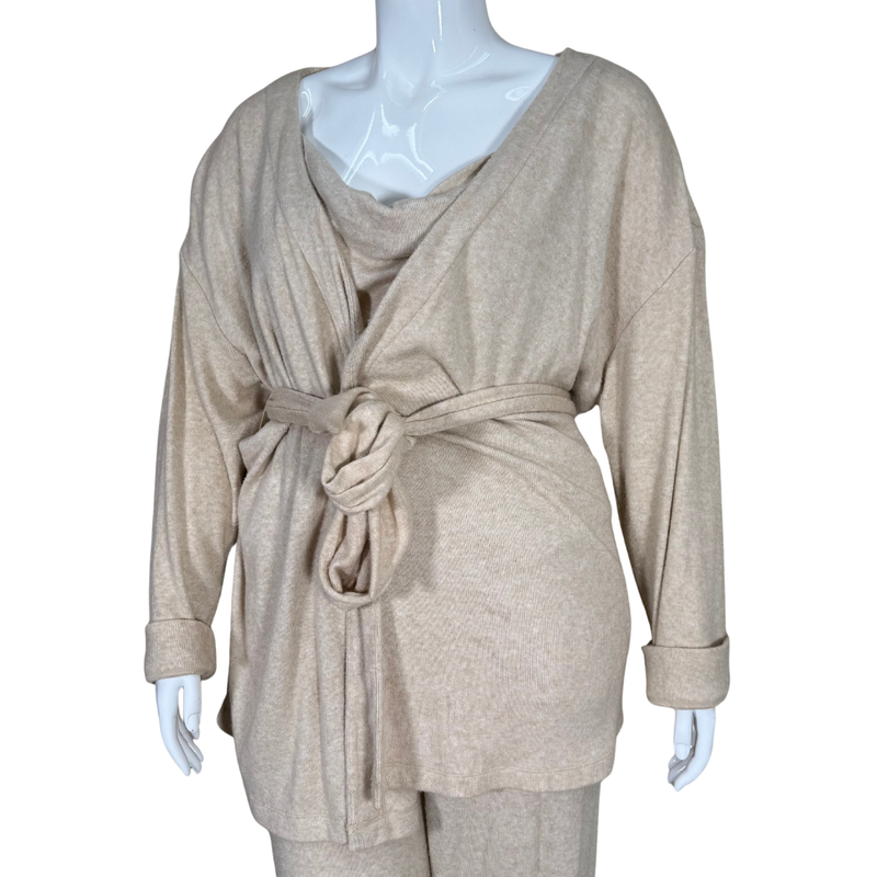 Load image into Gallery viewer, Beige wrap-style top on a mannequin with a white background
