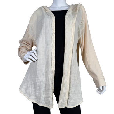 lightweight cream-colored Anthropologie Cozy Cream Hooded Open-Front Jacket offers a relaxed and breezy look, perfect for layering over casual outfits.
