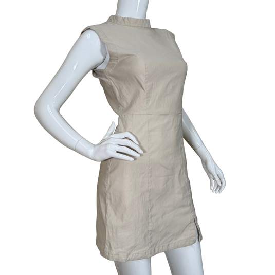 Beige dress on a mannequin against a white background
