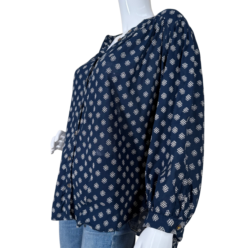 Load image into Gallery viewer, Navy blue patterned blouse on a mannequin with a white background
