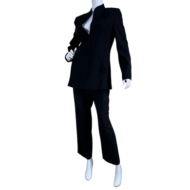 Black suit on a mannequin against a white background
