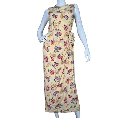 August Silk Floor-length Vibrant Floral Dress is a sleeveless, floor-length piece with a soft cream base adorned with a vibrant floral print