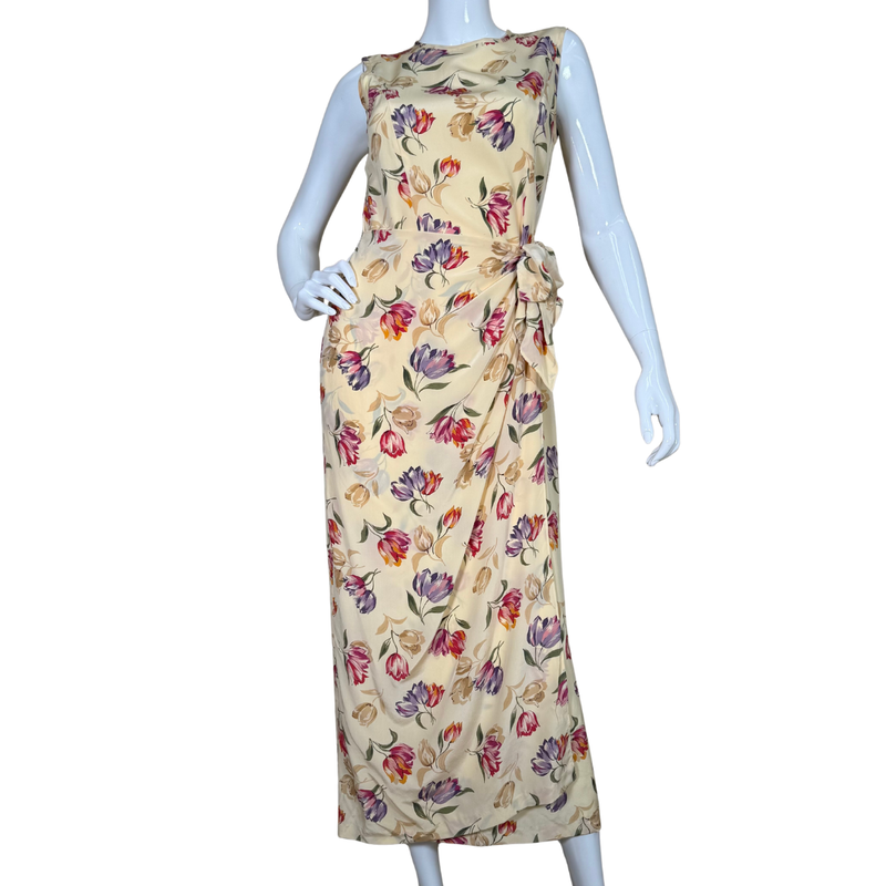 Load image into Gallery viewer, August Silk Floor-length Vibrant Floral Dress is a sleeveless, floor-length piece with a soft cream base adorned with a vibrant floral print
