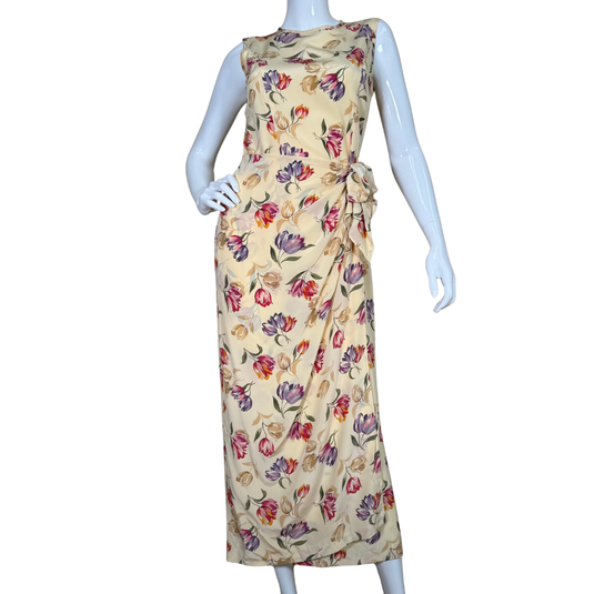 August Silk Floor-length Vibrant Floral Dress is a sleeveless, floor-length piece with a soft cream base adorned with a vibrant floral print